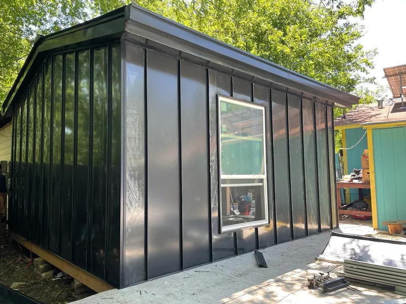 Black standing seam metal wall panels for Metal Roof Installation in Rochelle