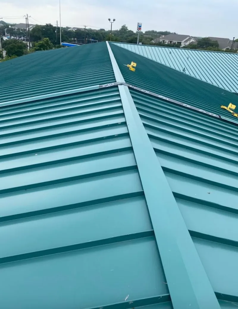 Green commercial metal roof ridge and valley for Metal Roof Repair in Rochelle